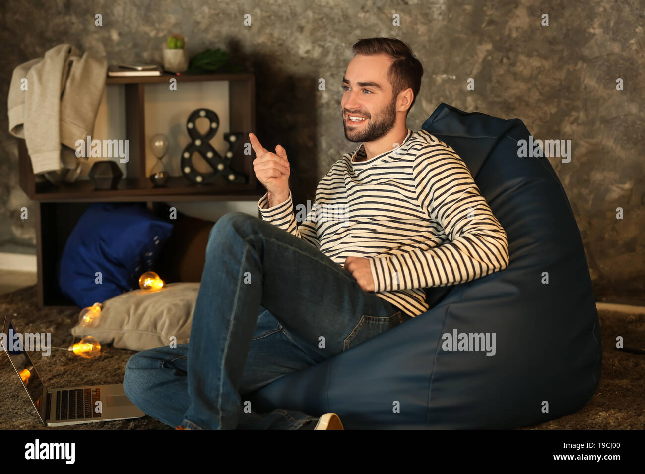 Man sitting on beanbag hi-res stock photography and images - Alamy