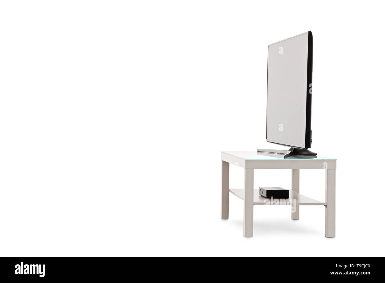 Side view shot of a flat screen TV on a white shelf isolated on white background Stock Photo Alamy