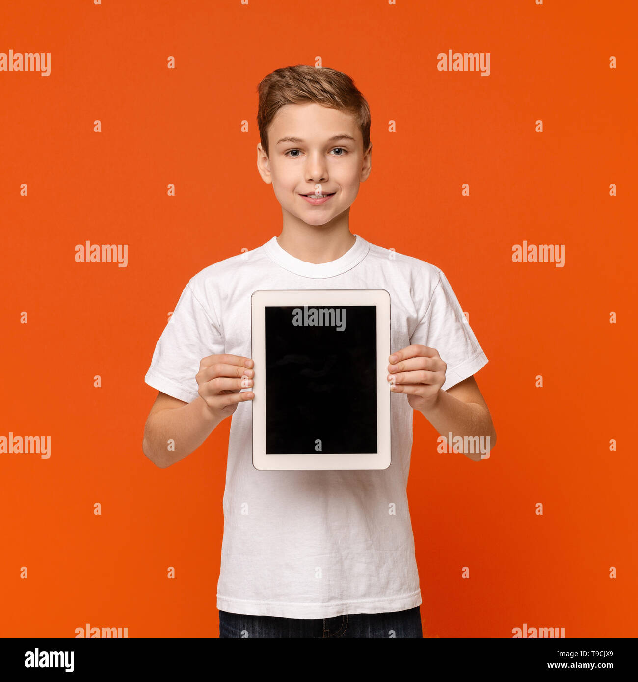 Little boy showing digital tablet with blank screen Stock Photo - Alamy