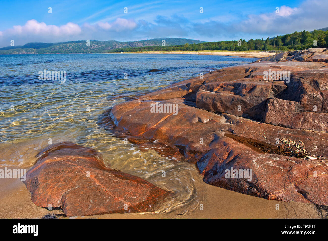 Rock and sandy beach at Prisoner's Cove on Lake Superior Neys