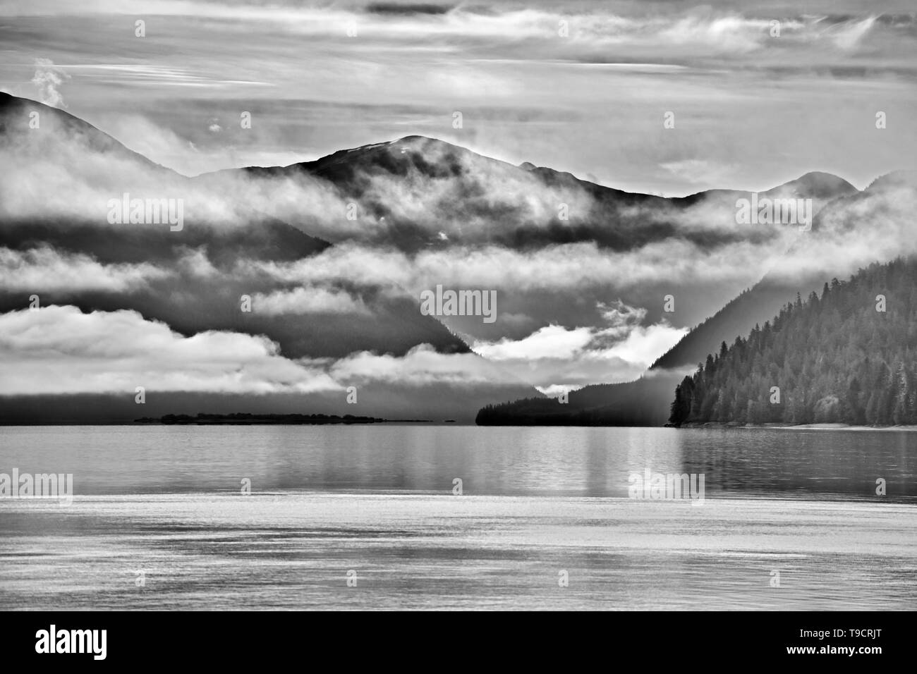 Fog rising over the Skeena River east of Prince Rupert East of  Prince Rupert British Columbia Canada Stock Photo