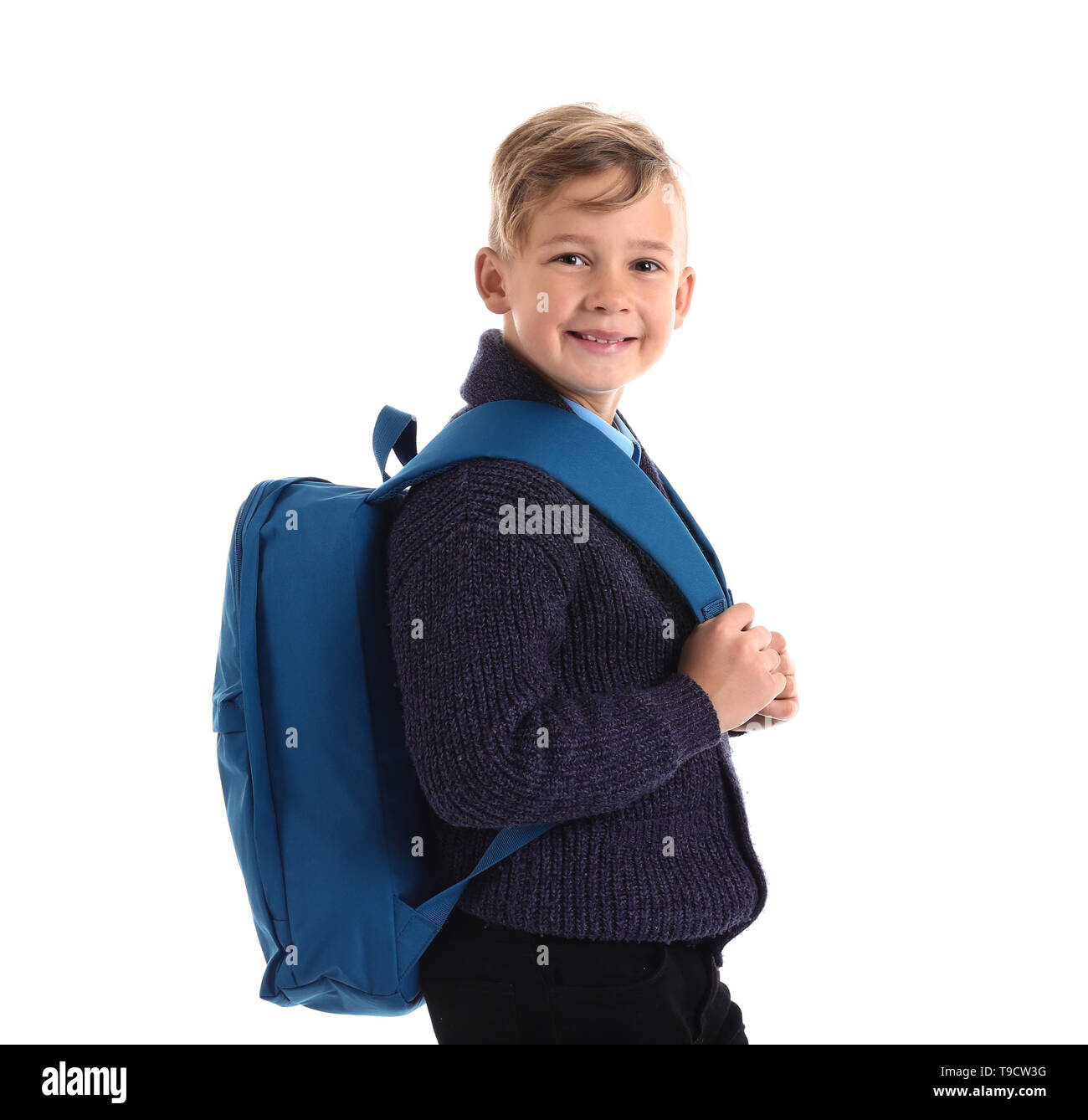Cute little schoolboy with backpack on white background Stock Photo - Alamy