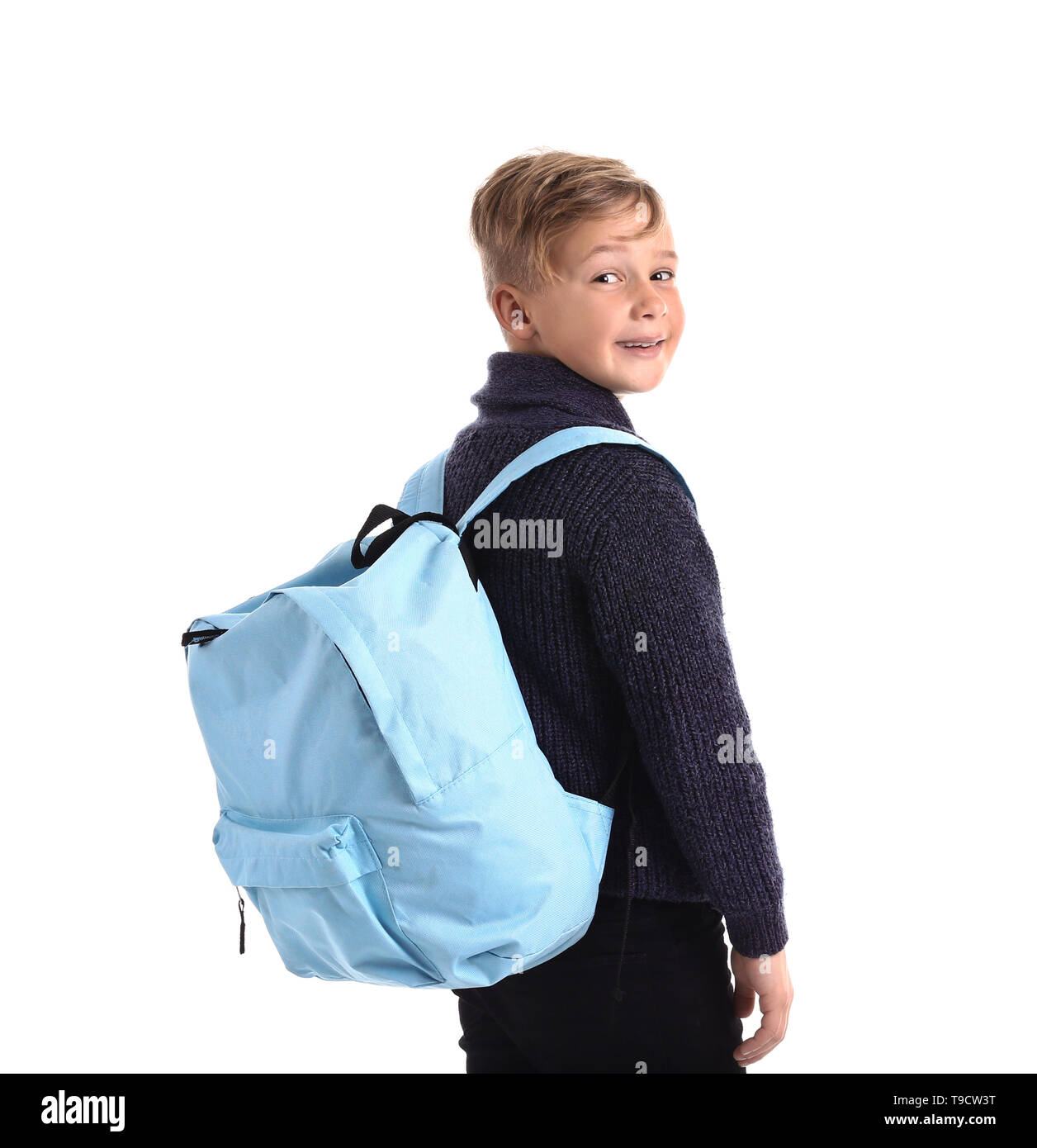Cute little schoolboy with backpack on white background Stock Photo - Alamy