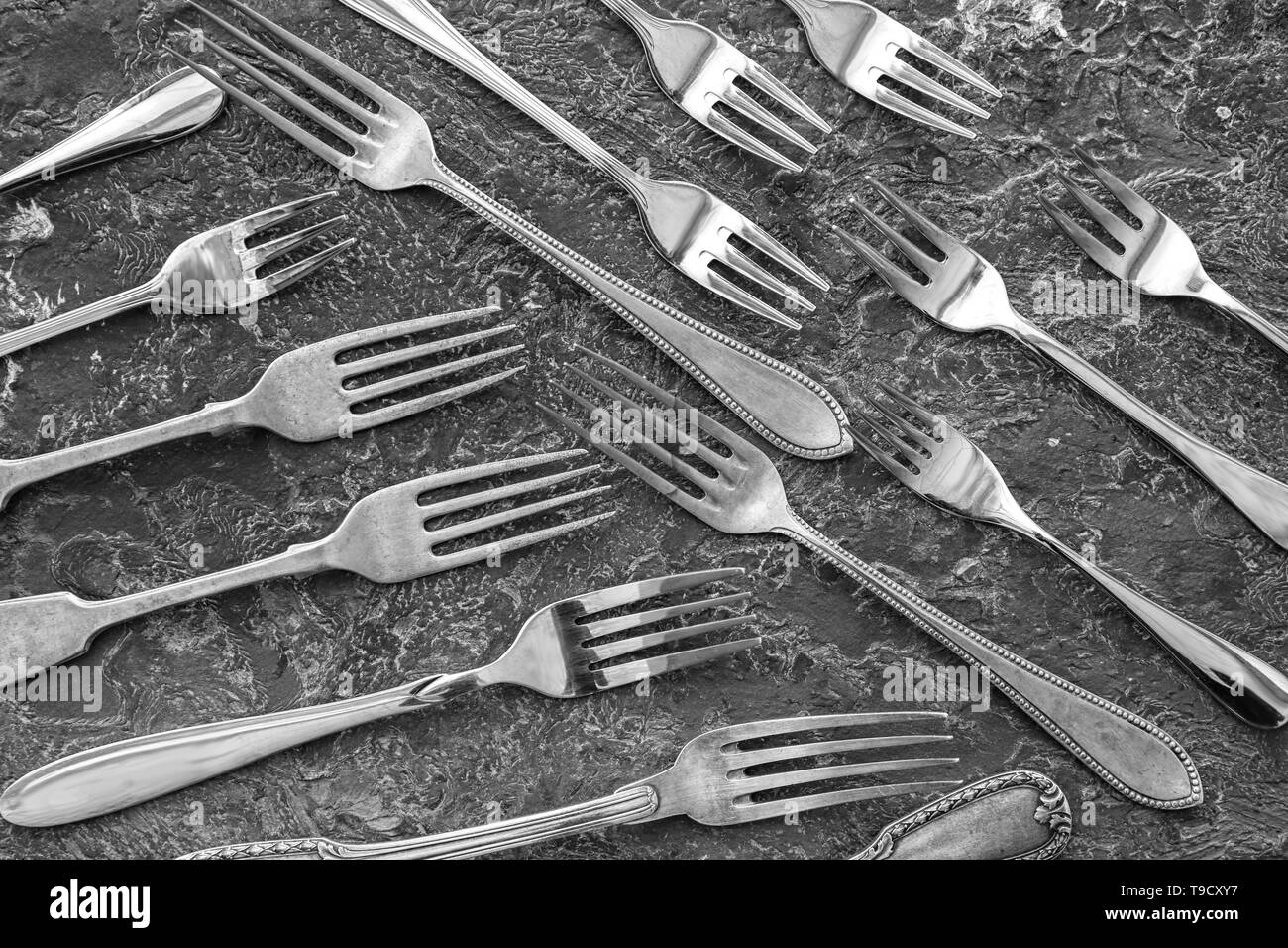 Many forks on grey background, flat lay Stock Photo