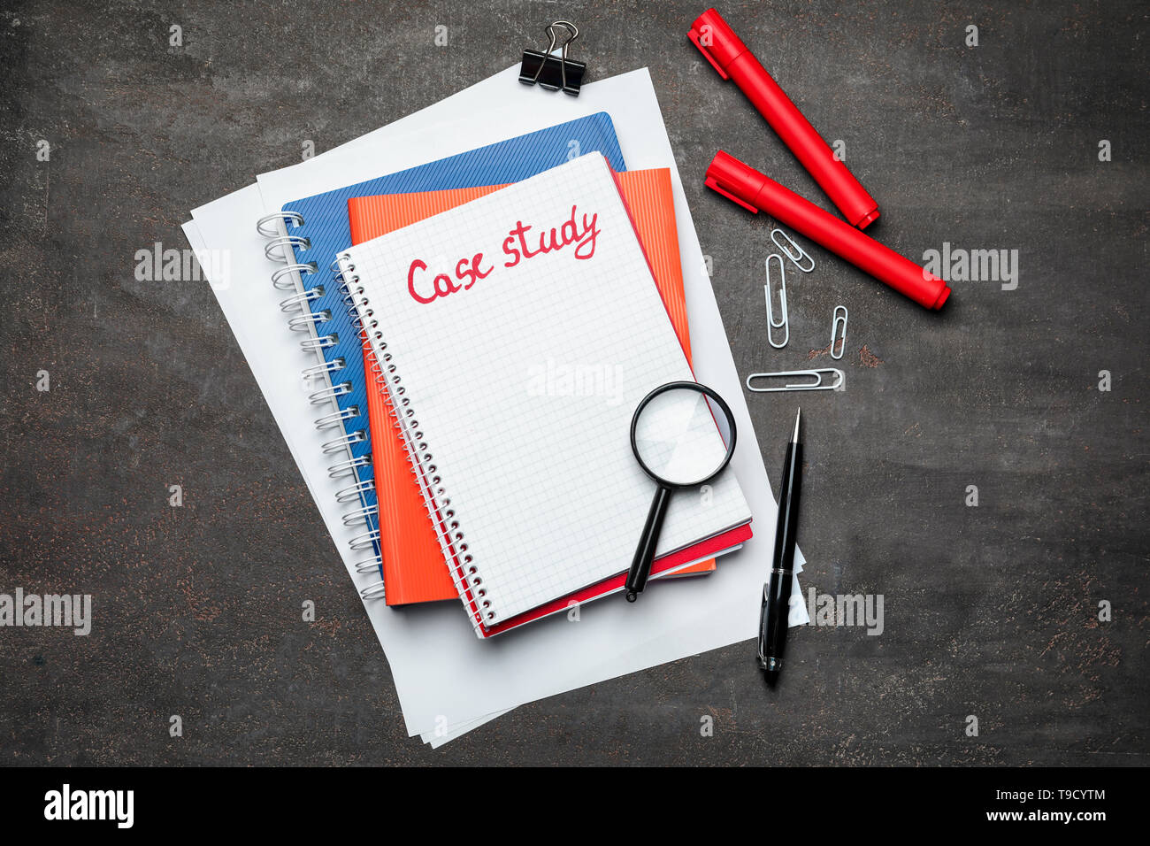 School stationery and notebook with text CASE STUDY on table, top view Stock Photo