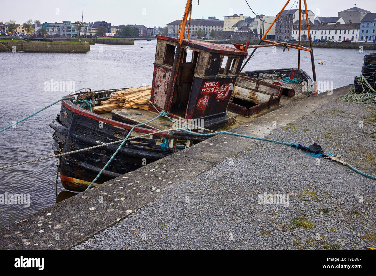 Older style fishing boat undergoing restoration at the Claddaghs in Galway Bay Stock Photo