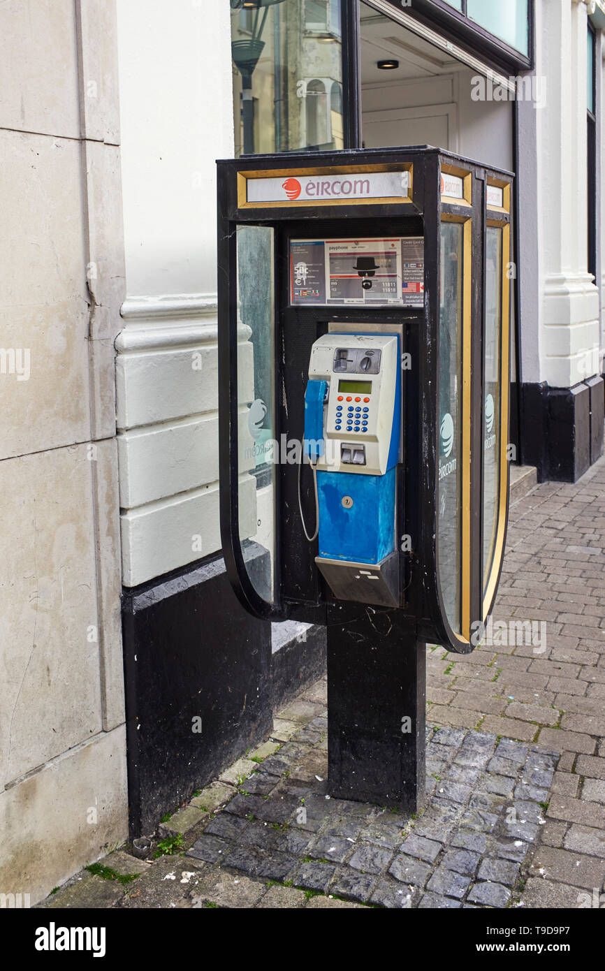 Irish phone box in the street at Galway Stock Photo