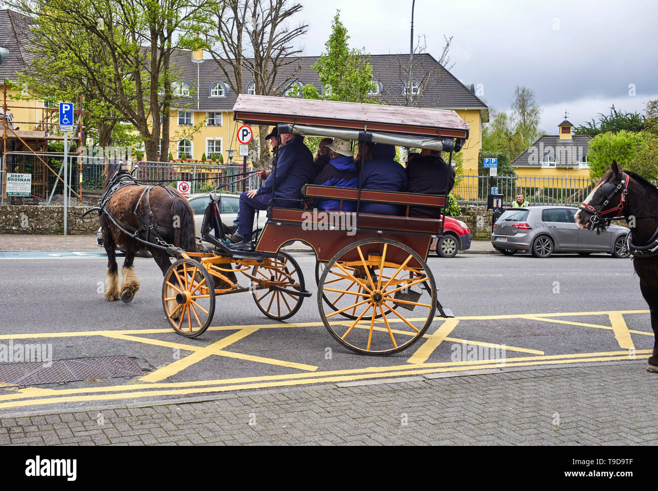 Horse drawn jaunting car or jarvey as it is known turning round Killarney, Ireland Stock Photo