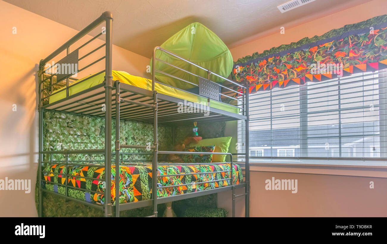 Clear Panorama Cozy room interior with a colorful triple bunk bed for ...
