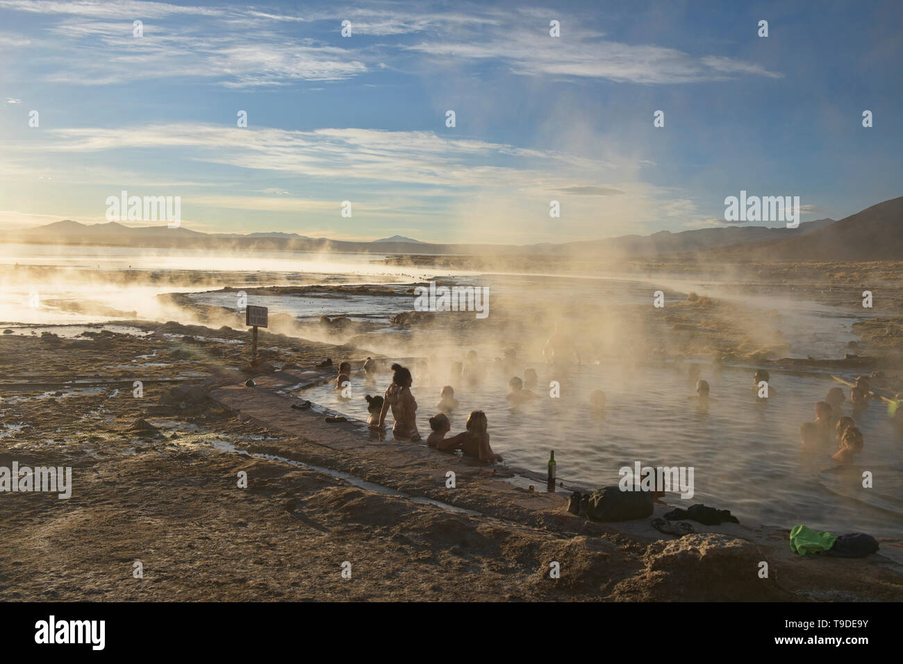 Enjoying the Aguas Termales de Polques Hot Springs at dawn, Salar de Uyuni, Bolivia Stock Photo