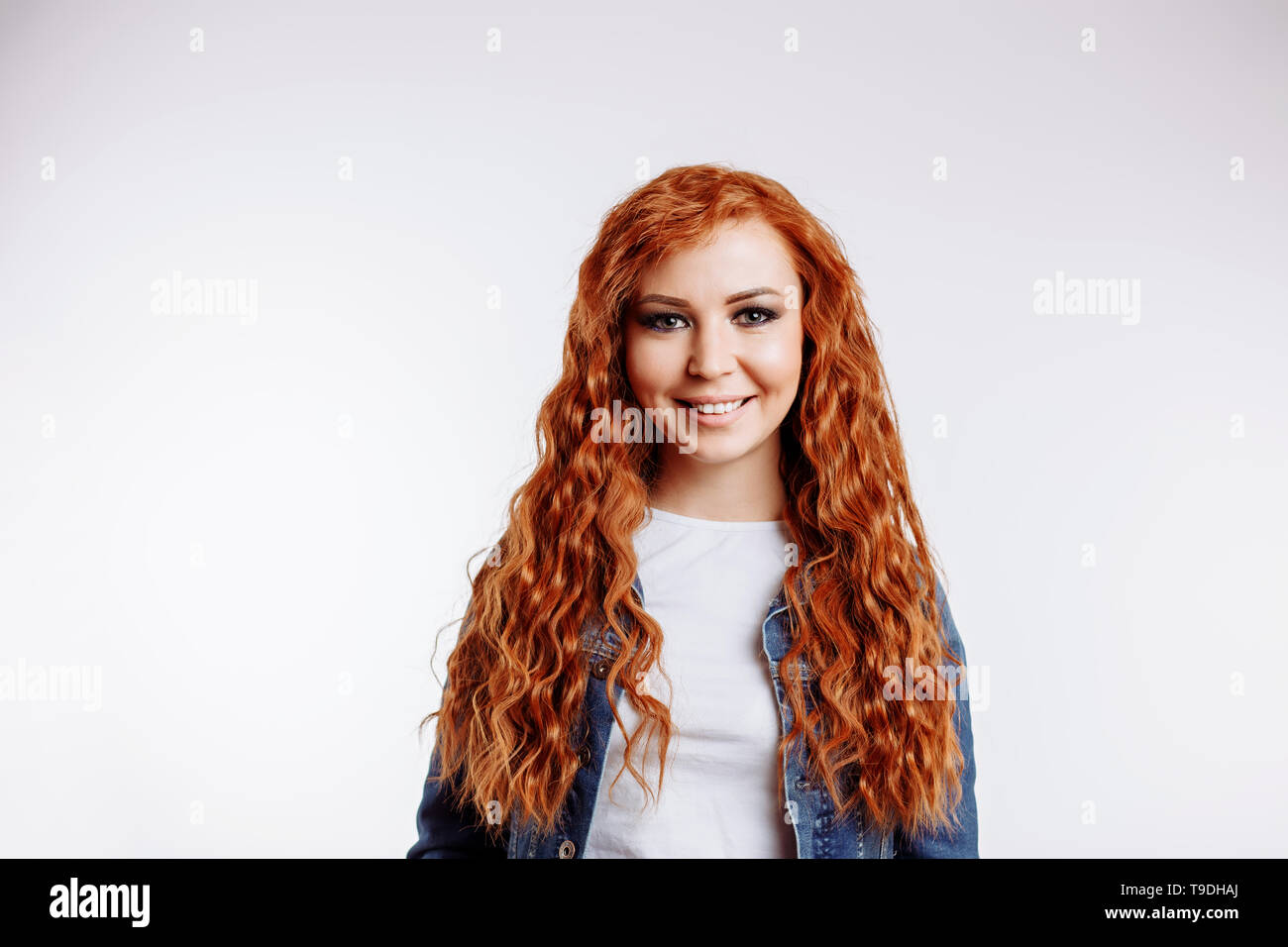 Gorgeous young redhead woman with long hair and green eyes smiling with teth looking at the camera , close up photo over white background with copy sp Stock Photo - Alamy Gorgeous young redhead woman with long hair and green eyes smiling with teth looking at the camera , close up photo over white background with copy sp Stock Photo - Alamy