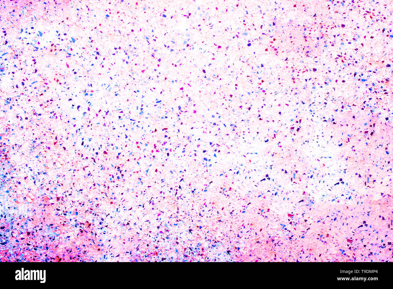 Bright multi colored pink with blue pebbles background for text Stock Photo