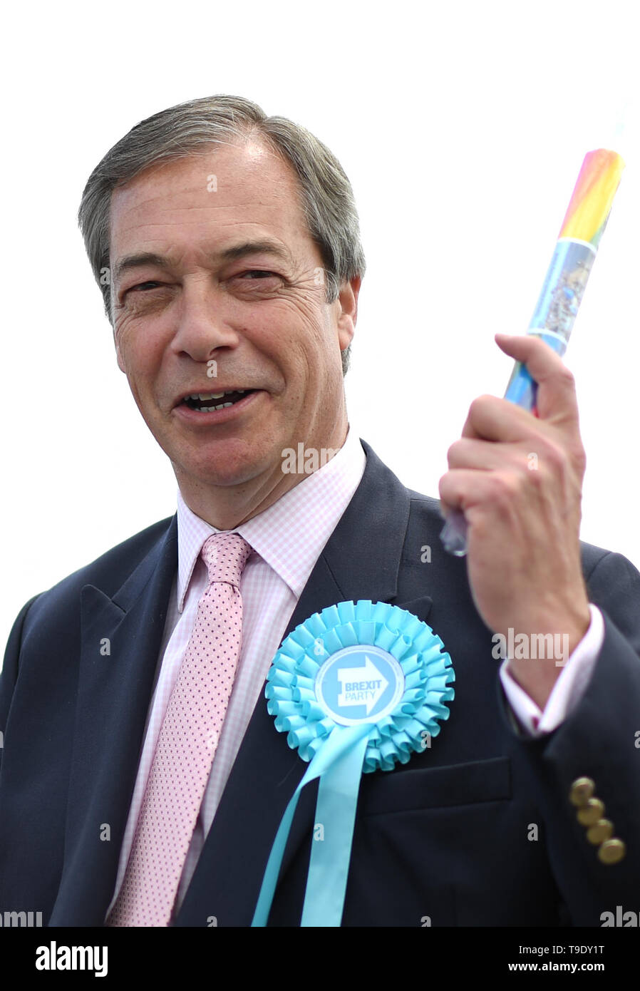 Brexit Party leader Nigel Farage with a stick of rock in Canvey Island