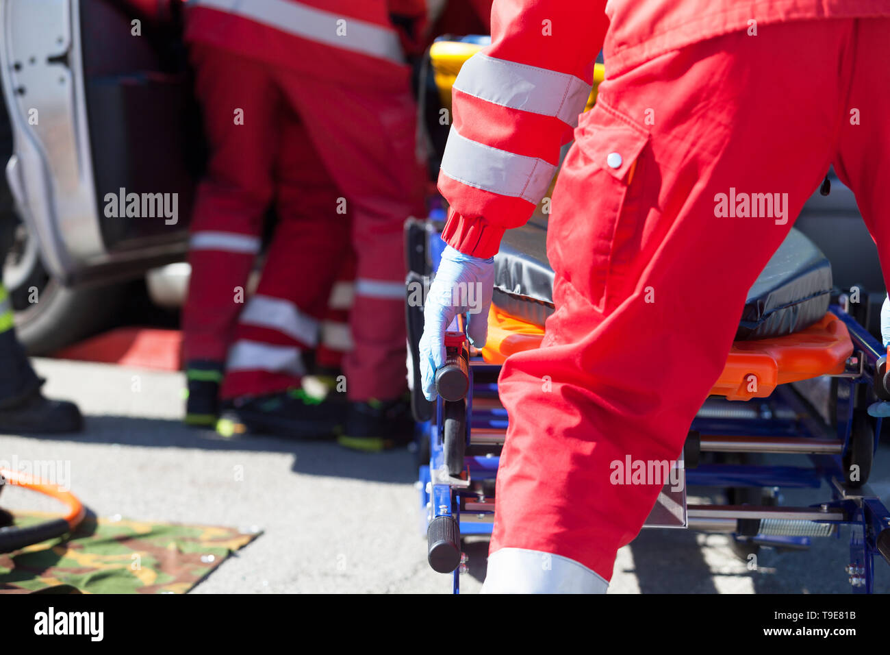 Paramedics in a rescue operation after a car crash Stock Photo - Alamy