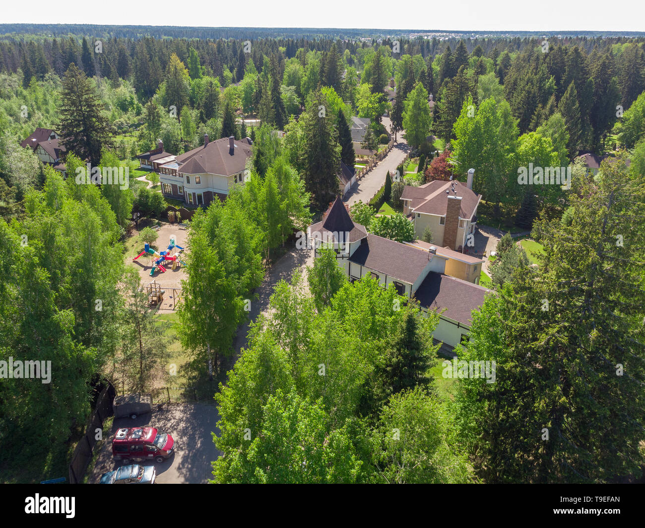View from height of private residential buildings in a pine forest in Russia Stock Photo