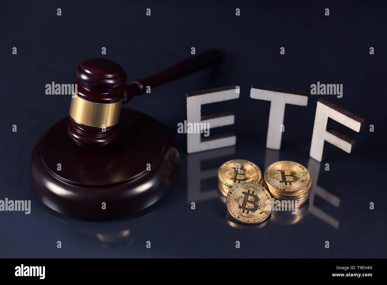 Bitcoin coins with ETF text and gavel put on dark background, Concept of  the approval of Exchange Traded Fund Stock Photo - Alamy