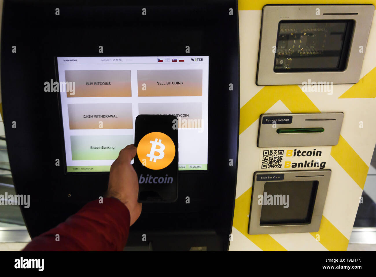 Prague, Czech Republic - May 18th 2019: Bitcoin ATM machine for buy and sell  cryptocurrency. Male Sell Bitcoins by ATM using smartphone, Prague, Czech  Stock Photo - Alamy