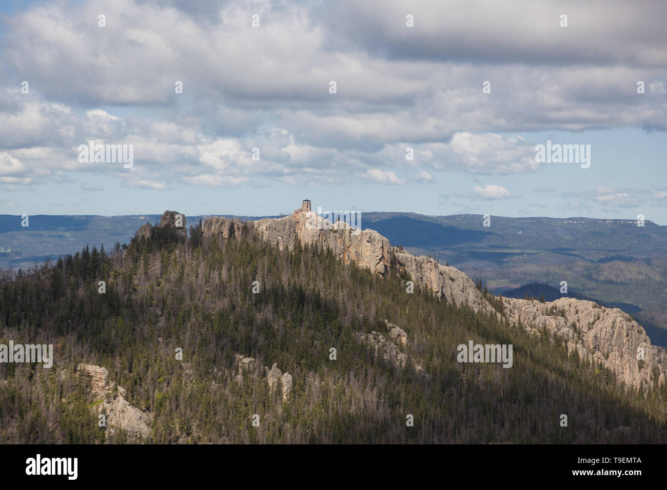 An aerial view of Black Elk Peak ( formerly Harney Peak) and tower which overlooks eroded rock