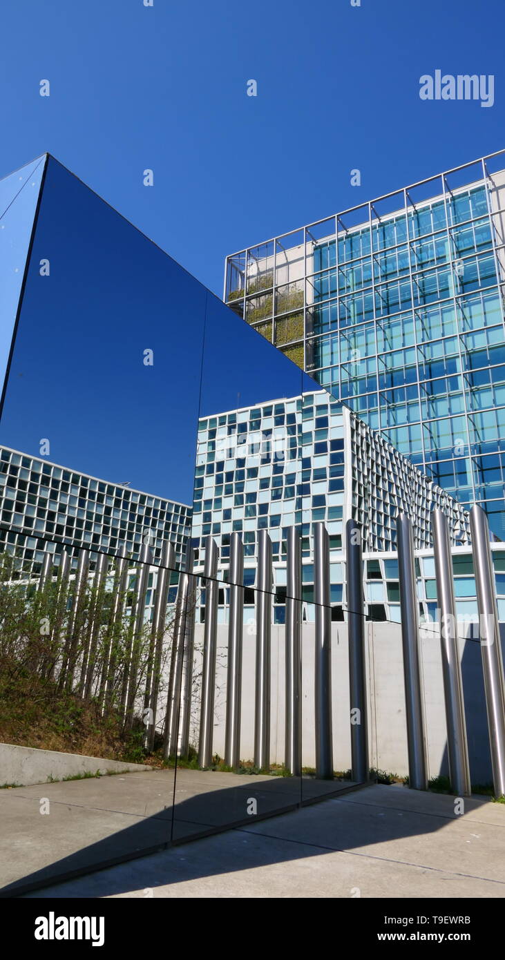 THE HAGUE, THE NETHERLANDS - APRIL 21, 2019: A special side view with reflection of the International Criminal Court Stock Photo