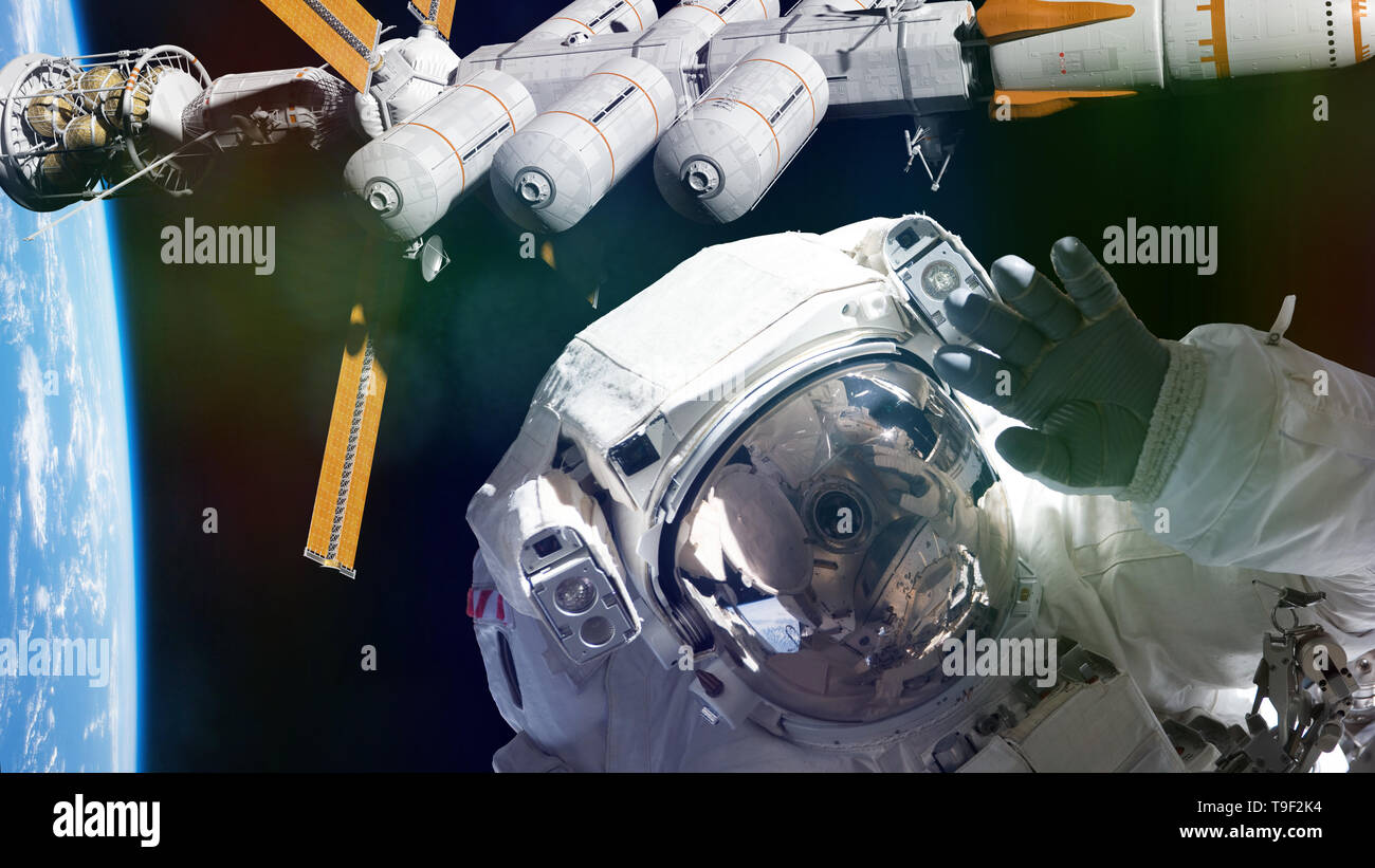 astronaut and spaceship in orbit of planet Earth waving into the camera (3d illustration, elements of this image are furnished by NASA) Stock Photo