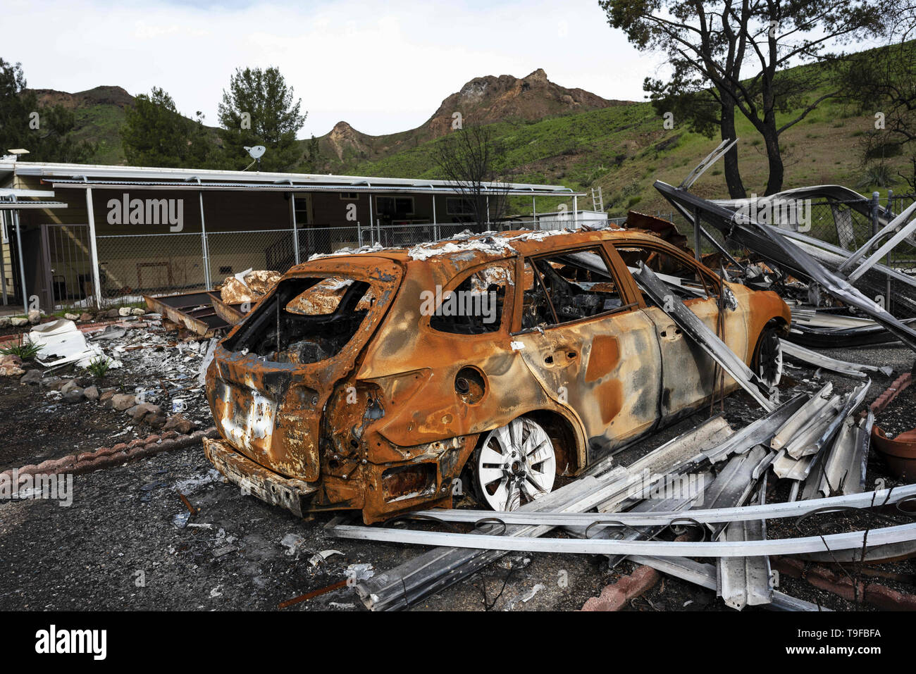 Agoura Hills, CA, USA. 11th Mar, 2019. A burned car is seen in the aftermath of the deadly Woolsey wid fire in Agoura Hills, California.Thousands of fire fighters battled the 2018 Woolsey brush fire in southern California as tens of thousands of people were under mandatory evacuation. 1500 destroyed - 341 damaged, structures were destroyed and damaged, 3 fire fighters were injured and 3 civilian fatalities encountered. The cause of the fire is still uncertain. Credit: Ronen Tivony/SOPA Images/ZUMA Wire/Alamy Live News Stock Photo