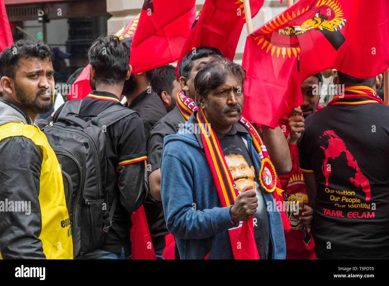 London, UK. 18th May 2019. Several thousand Tamils, many with Tamil Eelam flags, march through London on Mullivaikkal Remembrance Day in memory of those killed by Sri Lanka’s genocidal war against the Tamils, which ended ten years ago. Many wore shirts with maps of Tami Eelam or pictures of LTTE founder Velupillai Prabhakaran. They call for a political solution which gives Tamils back control of their homeland of Tamil Eelam, and for an end to the ban on the Tamil Tigers. Public commemorations of the many thousands of war dead are forbidden in Sri Lanka. Peter Marshall/Alamy Live News Stock Photo