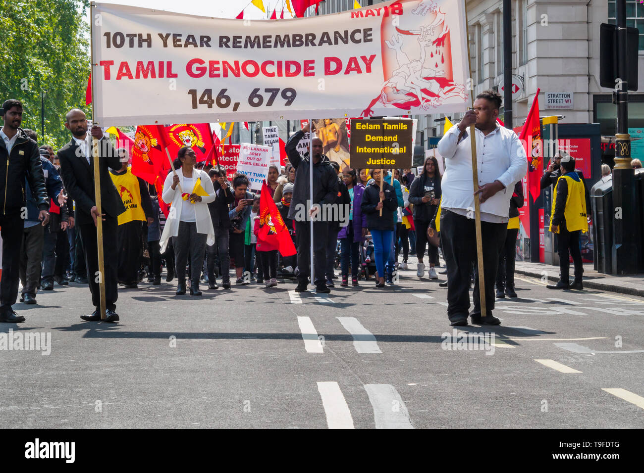 London, UK. 18th May 2019. Several thousand Tamils, many with Tamil Eelam flags, march up Piccadilly on Mullivaikkal Remembrance Day in memory of those killed by Sri Lanka’s genocidal war against the Tamils, which ended ten years ago. They call for a political solution which gives Tamils back control of their homeland of Tamil Eelam, and for an end to the ban on the Tamil Tigers. Public commemorations of the many thousands of war dead are forbidden in Sri Lanka. Peter Marshall/Alamy Live News Stock Photo