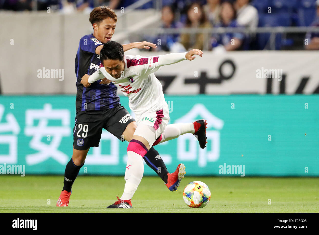 Osaka, Japan. 18th May, 2019. (L to R) Leo Takae (Gamba), Naoyuki ...