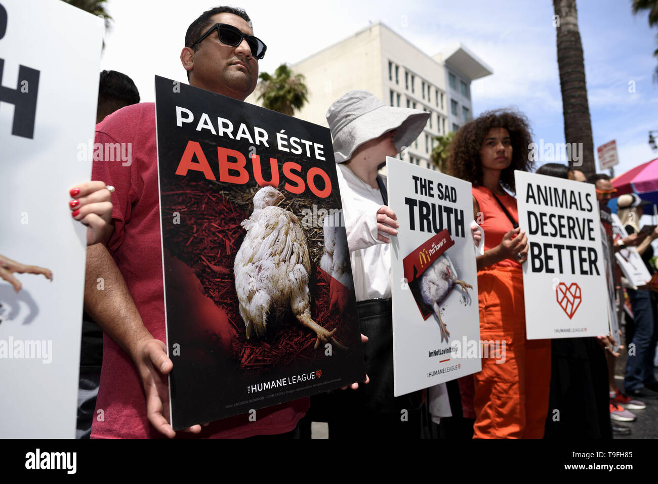 Los Angeles, CA, USA. 27th Feb, 2019. Animal rights activists seen holding placards during a protest of what they called, animal cruelty in the chicken supply chain of McDonald's. The protest took place in front of a McDonald's fast food restaurant on the Hollywood Walk of Fame in Los Angeles. Credit: Ronen Tivony/SOPA Images/ZUMA Wire/Alamy Live News Stock Photo