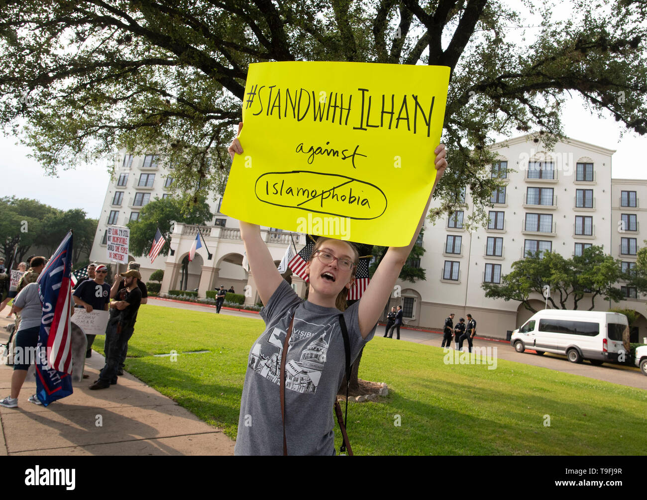 Supporters of controversial Congresswoman Ilhan Omar of Minnesota counter-demonstrate against anti-Muslim protesters as she spoke at Austin's annual city-wide iftar dinner in honor of the 14th day of Ramadan. Omar is one of two Muslims serving in the United State Congress. Stock Photo