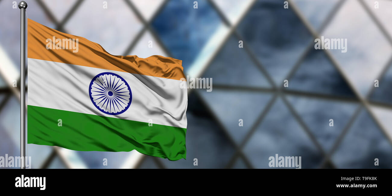 India flag waving in the wind against blurred modern building. Business ...