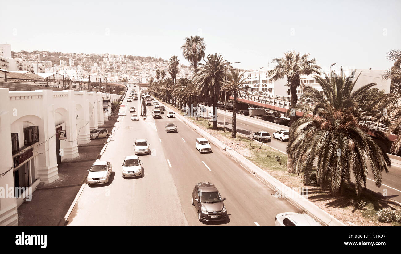 Multi lane road along the coastline and the harbor of Algiers, Algeria Stock Photo