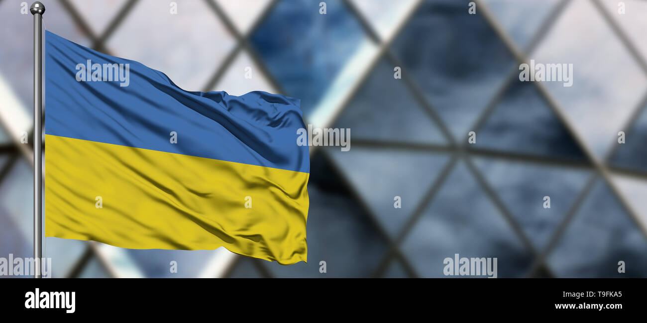 Ukraine flag waving in the wind against blurred modern building ...