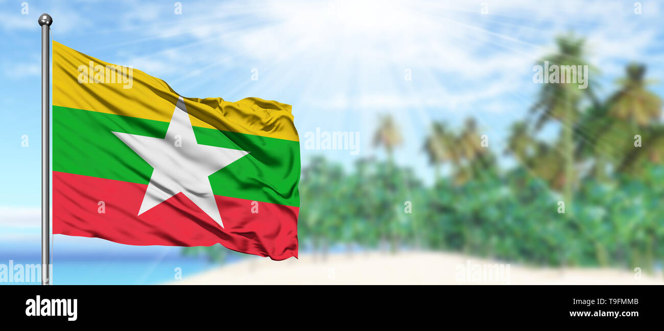 Waving Myanmar flag in the sunny blue sky with summer beach background ...