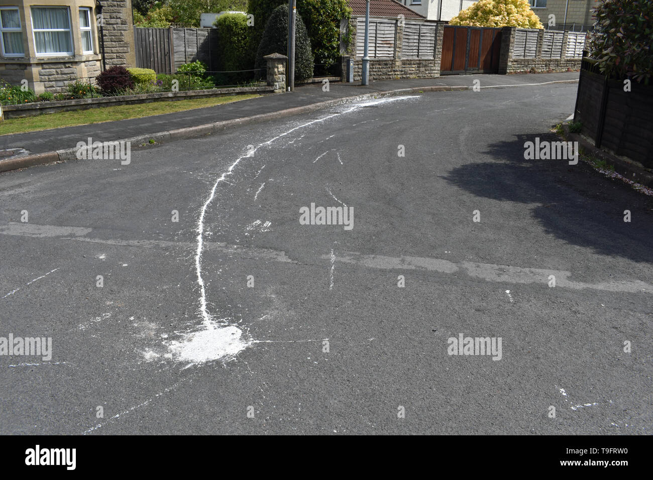 White paint spill, Frome, UK Stock Photo