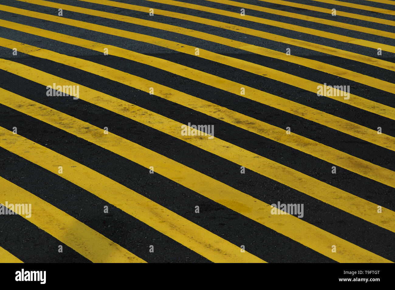 Yellow black striped road construction hires stock photography and