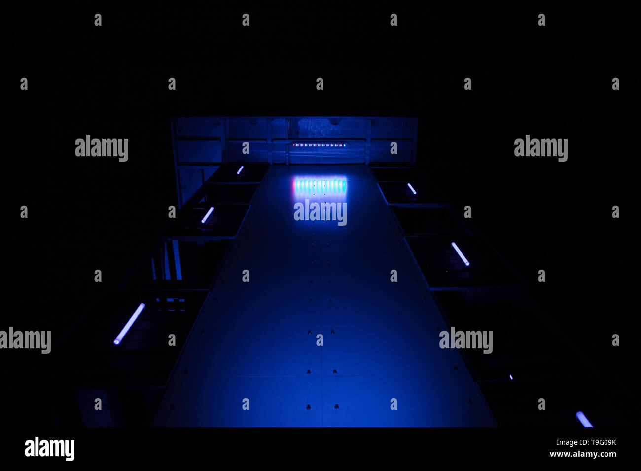 Industrial metallic structure with blue LED lights Stock Photo