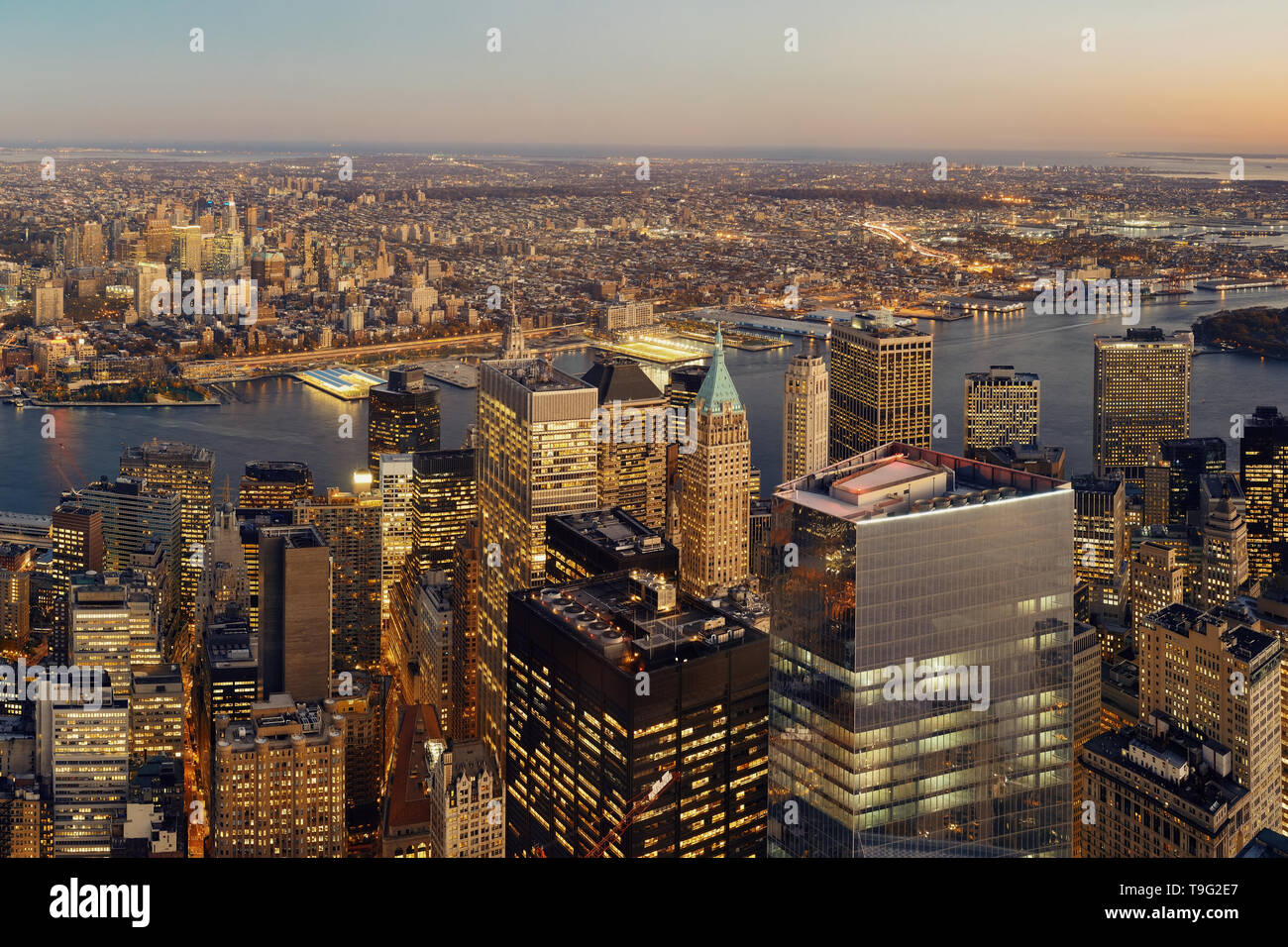 Manhattan downtown sunset rooftop view with urban skyscrapers in New ...