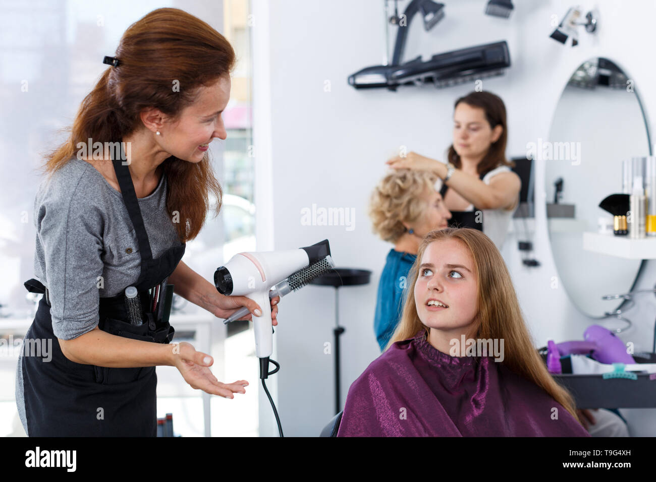 Drying hair hair dryer round hi-res stock photography and images - Alamy