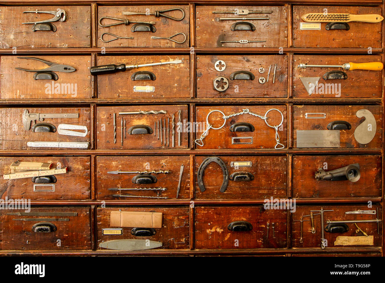 A detail of an old cupboard with drawers, part of the old vintage ironmongery. Stock Photo