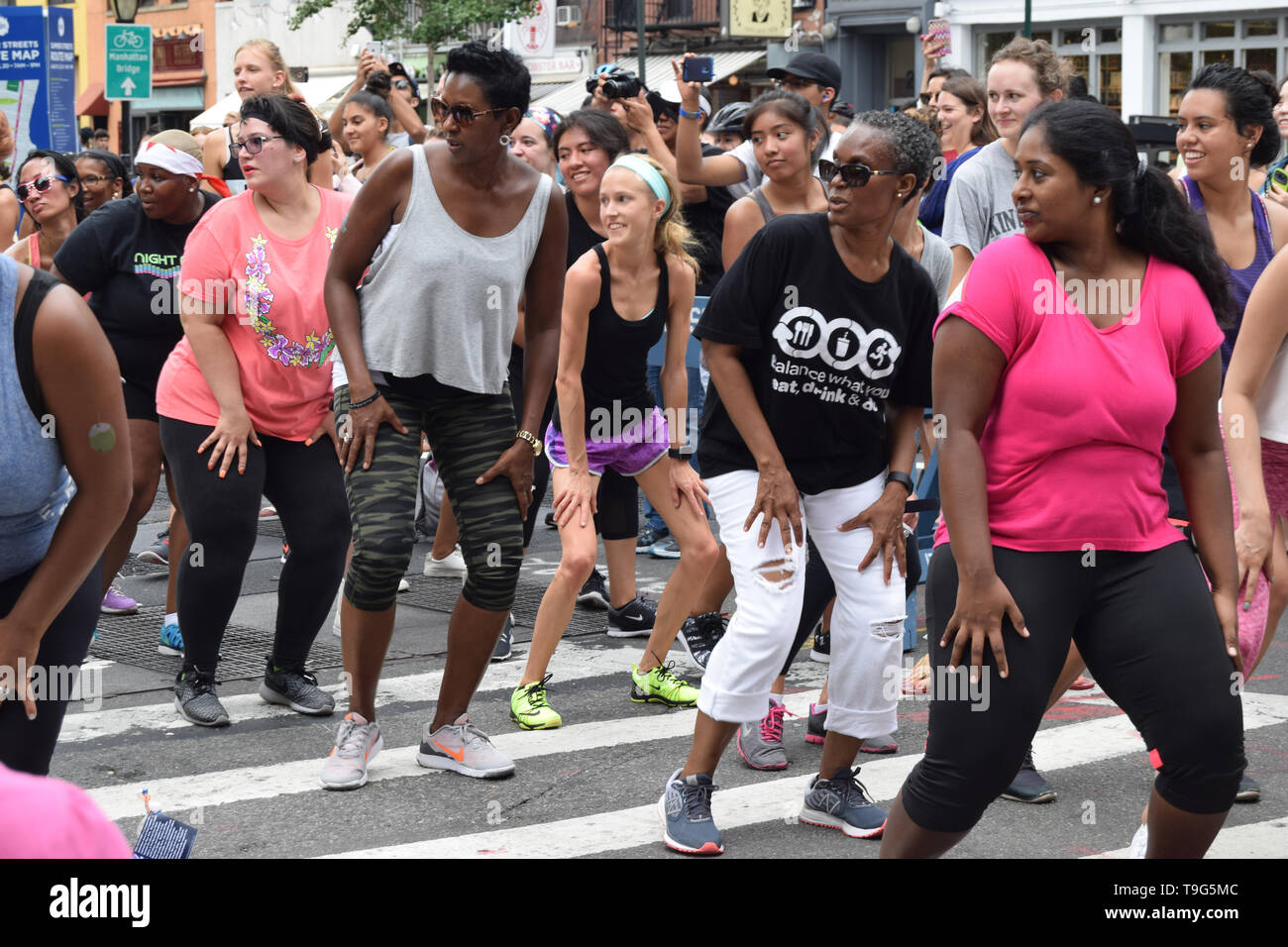 people doing zumba in the streets Stock Photo