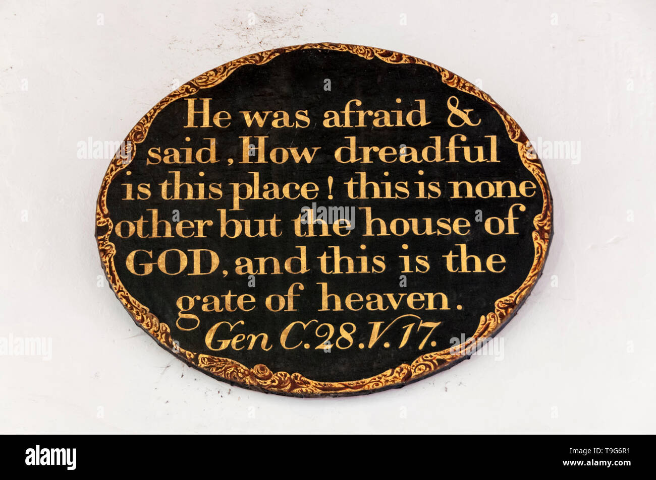 One of the biblical texts on the walls of St George's church at Ivychurch on Romney Marsh. Known as the cathedral of the marsh. Stock Photo