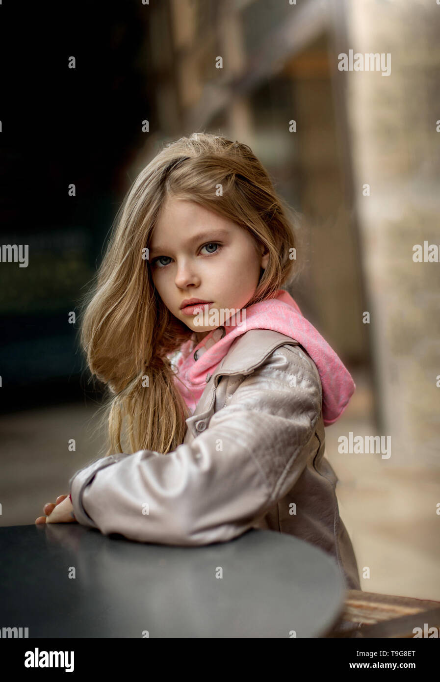 Very Beautiful Little Girl With Long Blonde Hair And Blue Eyes