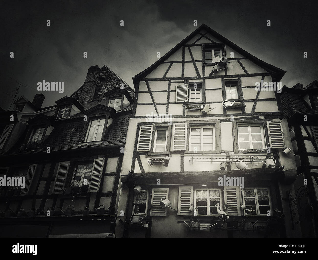 Fachwerk timber framed house in Colmar city, France, Alsace. Traditional architecture medieval home facade, historic town. Beautiful black and white v Stock Photo