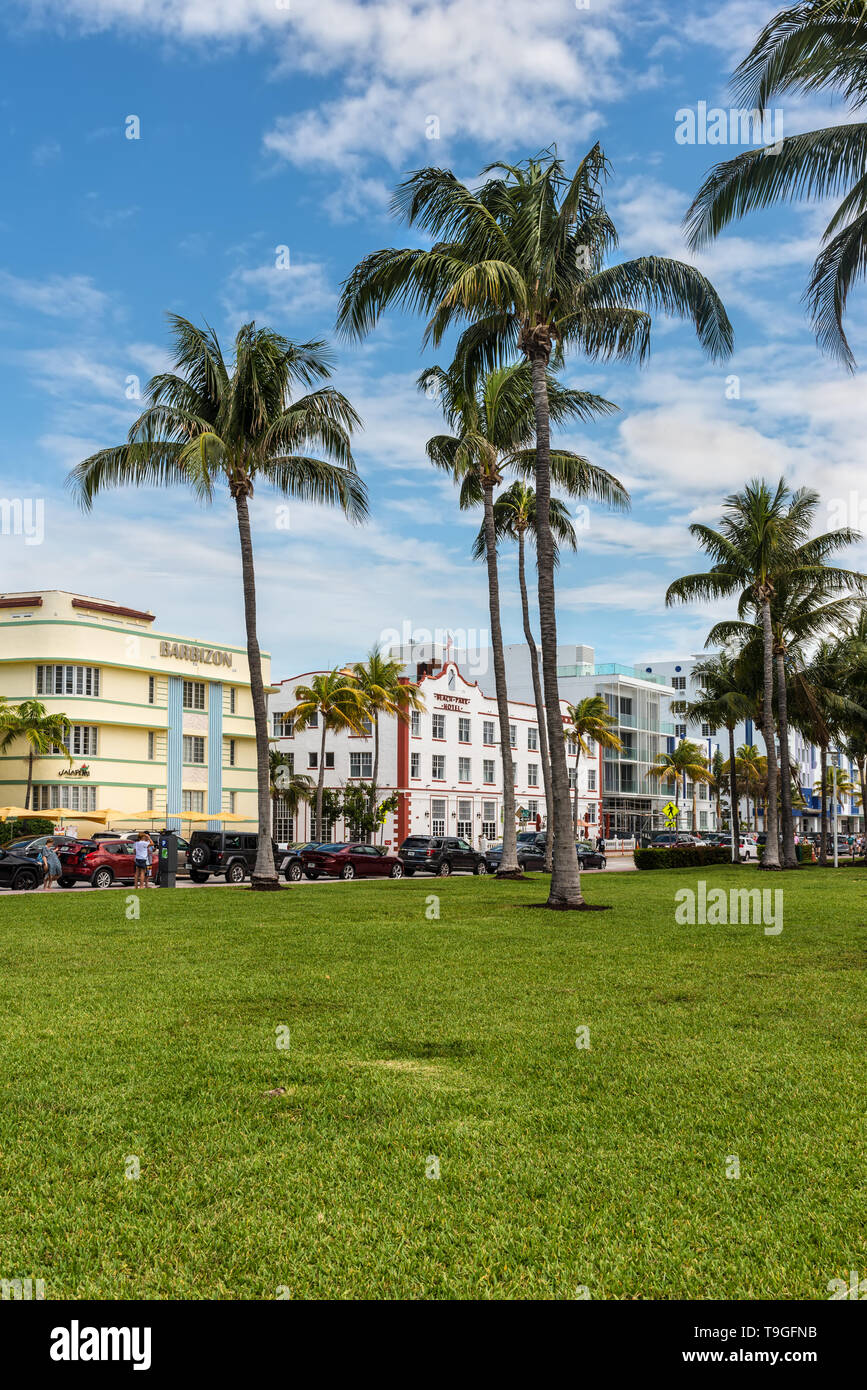 Miami, FL, USA - April 19, 2019: Lummus Park at the historical Art Deco District of Miami South Beach with hotels, cafe and restaurants on Ocean Drive Stock Photo