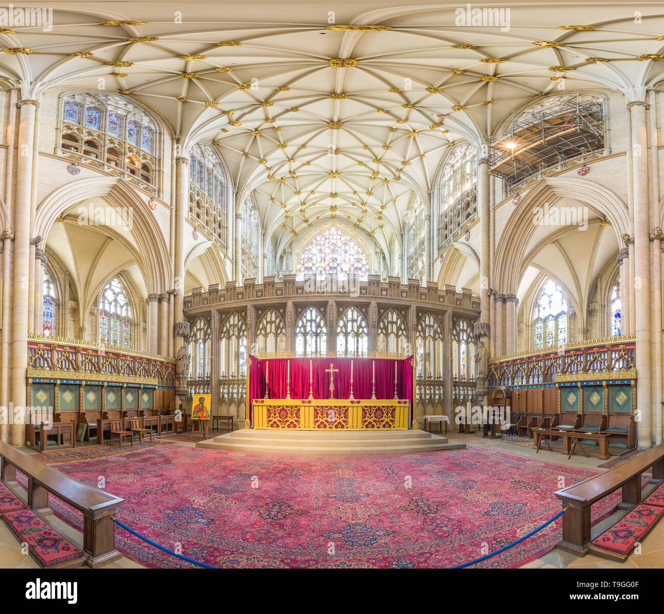 High altar and quire (choir) surrounded by stained glass windows in the medieval christian minster (cathedral) at York, England. Stock Photo