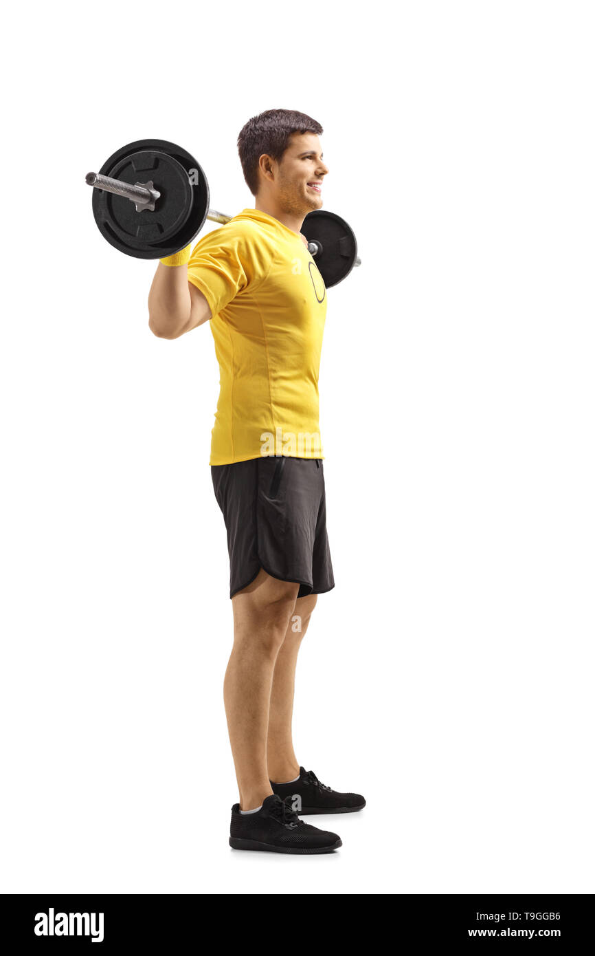 Full length shot of a young man standing and lifting weights on