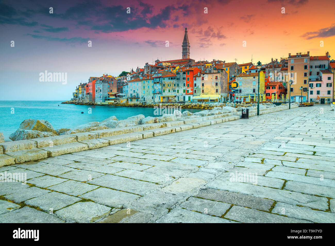 Popular vacation place, colorful old mediterranean buildings and seashore with spectacular promenade at sunset, Rovinj, Istria region, Croatia, Europe Stock Photo