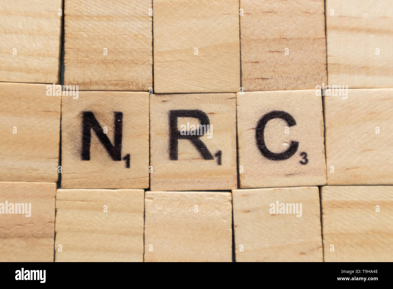 Maski, India- 18, May 2019: NRC or National Register of Citizens in wooden block letters. Stock Photo
