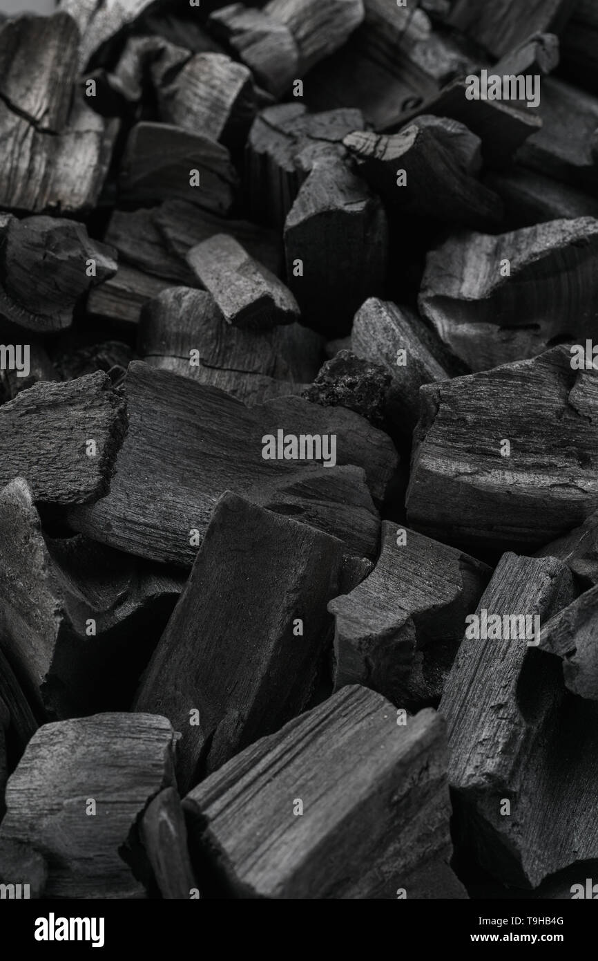 Close-up shot of natural charcoal. Black texture background Stock Photo ...